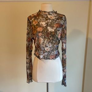 Sheer long sleeve top with floral pattern